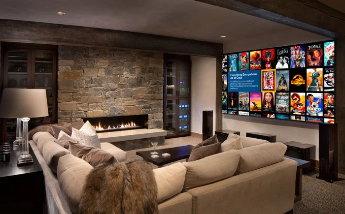 Kaleidescape movie library displayed on a large TV in a furnished living room